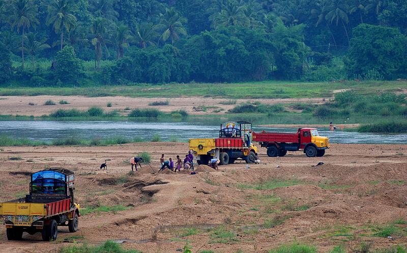 800px-Trucks-looting-sand-from-bhararthapuzha