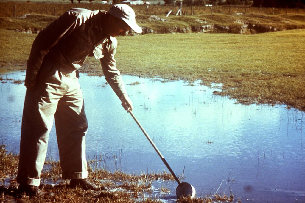 Entomologic field technician who was in the process of using a d