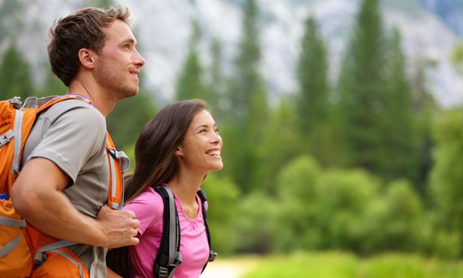 Couple - active hikers hiking in Yosemite