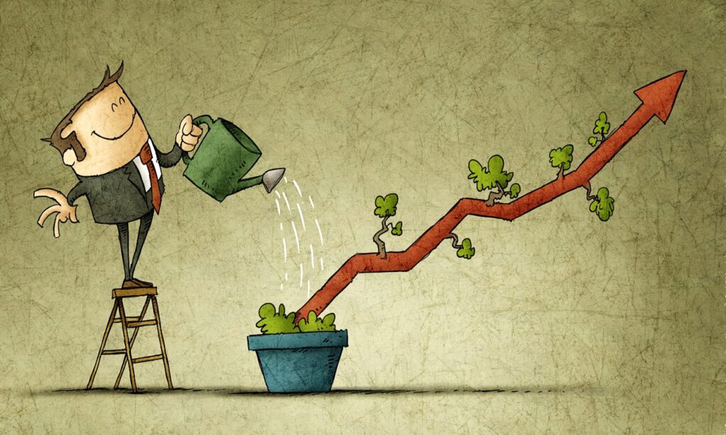 Business man Watering a plant shaped like a graph in a pot