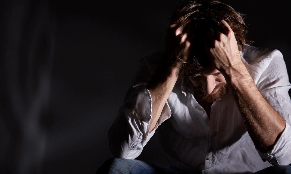 Man suffering emotional pain