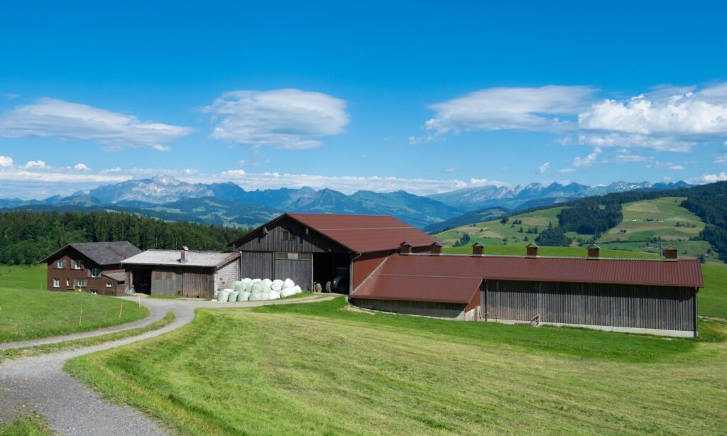 Zurich, Switzerland - June 12th 2023: A modern farm within the hills in the Zurich region.