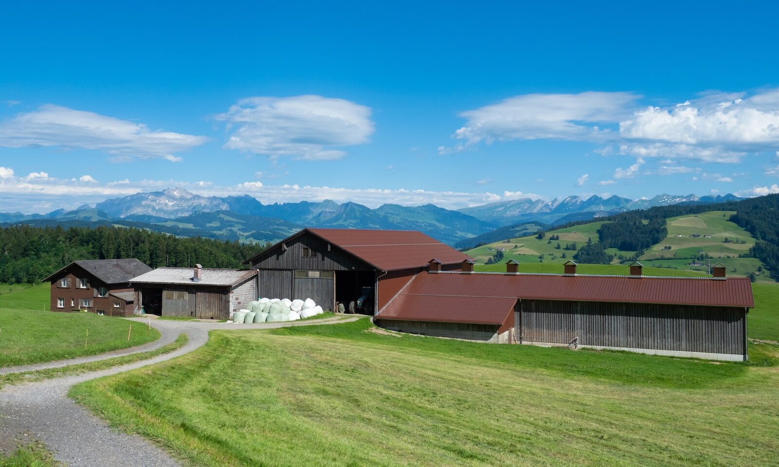 Zurich, Switzerland - June 12th 2023: A modern farm within the hills in the Zurich region.